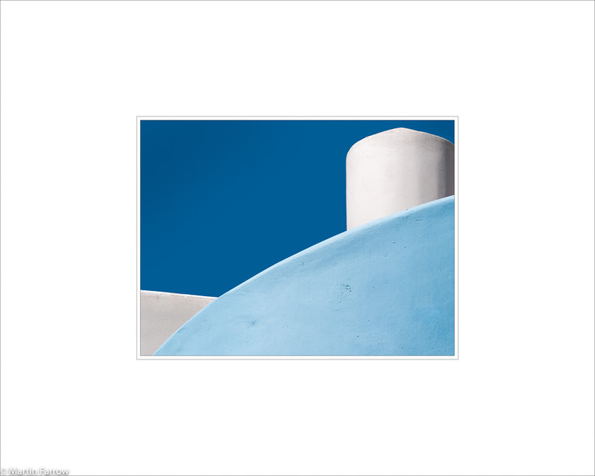 05 Blue-Wall 
 Curved blue wall and white structure against blue sky 
 Keywords: ARPS panel fine art blue white simple abstract graphic architecture wall curve tower sky Santorini Greece island Samos