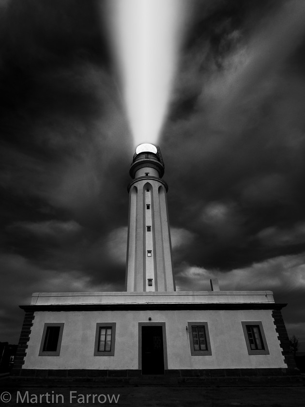 Spanish-Lighthouse-Cape-Trafalgar-Night 
 Lighthouse at Cape Trafalgar, Spain at night with beam 
 Keywords: beach, lighthouse,sun,grass,evening,warm,sea,shore,ocean,night,beam,light,shining,guiding