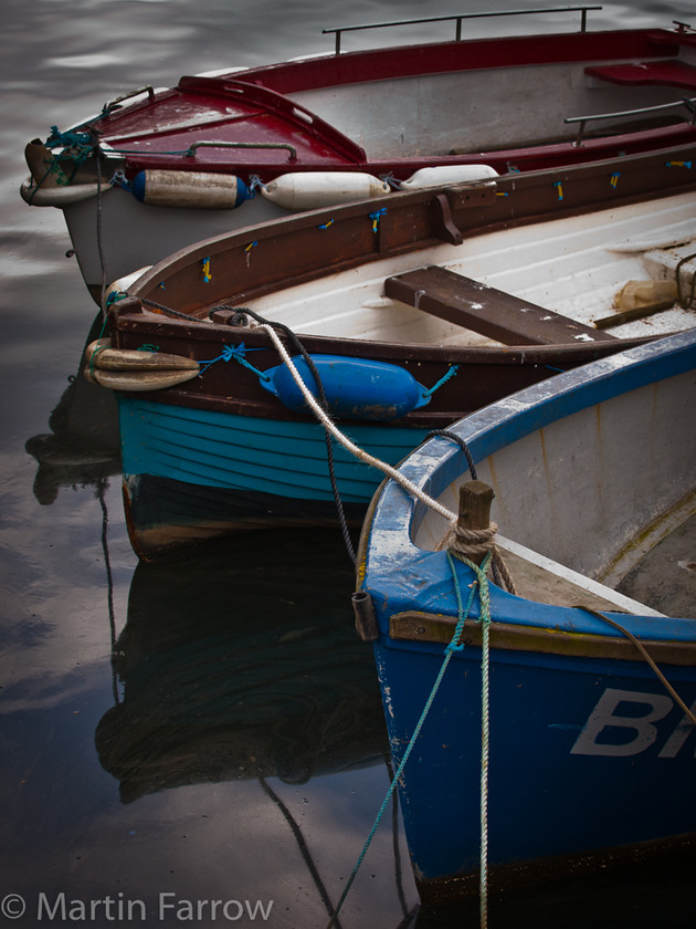 Working-Boats 
 Working boats in harbour 
 Keywords: Brixham, Devon, boats, harbour, sea,calm,water,reflections,moored,rope,blue,red