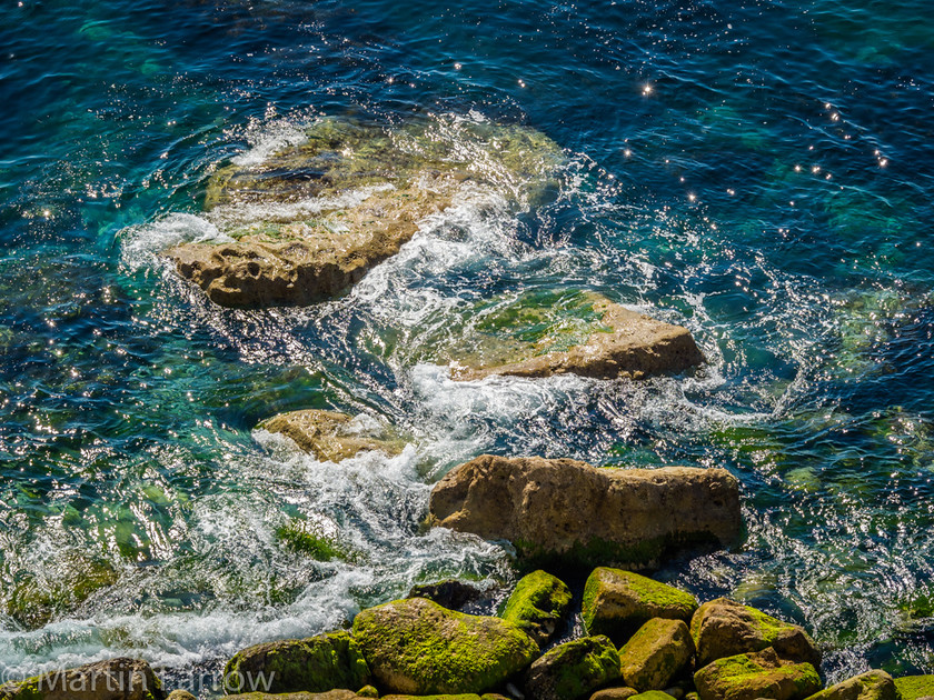 Gentle-Turbulence 
 Gentle blue sea breaking over rocks on the shore 
 Keywords: Dorset, Portland, blue, breaking, gentle, landscape, ocean, rocks, sea, sparkle, summer, sun, turbulence, view, water, waves