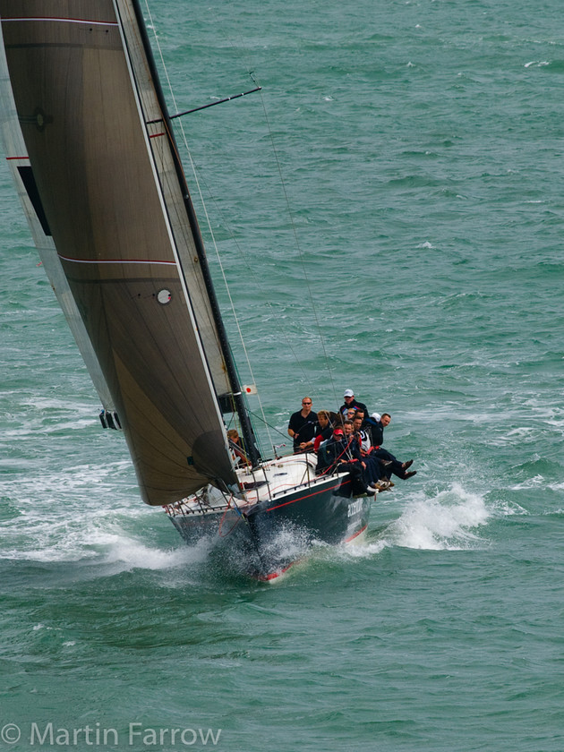 Balance 
 Yacht racing bow on 
 Keywords: Cowes Week, boats, sailing, sea, yachts,sail,balance,tilt,water,sea,ocean,coast,recreation,sport