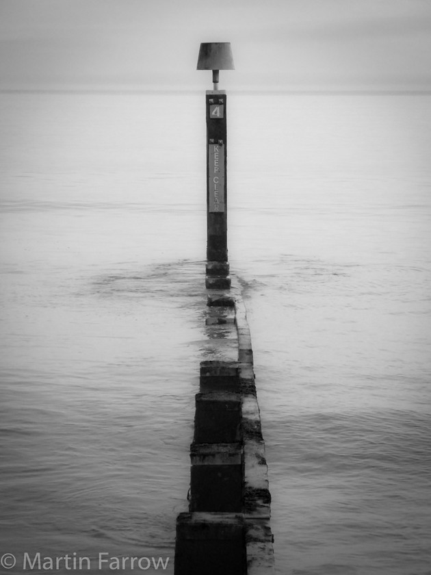 Groyne-No-0004 
 Groyne in calm water 
 Keywords: Bournemouth, beach, coast, sea,ocean,shore,beach,groyne,mono