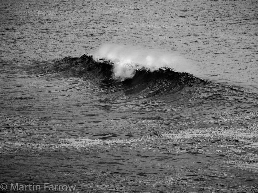 Breaking-Wave 
 Single wave breaking with foamong top, monochrome 
 Keywords: Cornwall, St Ives.coast, breaking, monochrome, ocean, sea, shore, single, spray, waves, white top