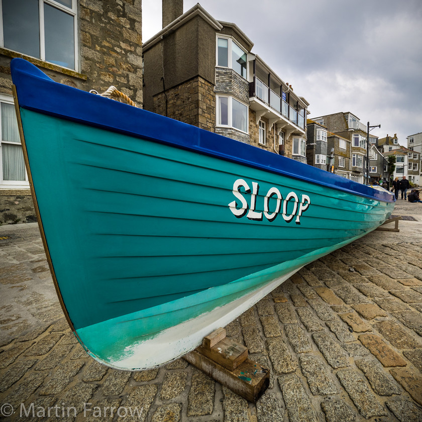 Sloop 
 Rowing gig ashore with fresh green paint 
 Keywords: Cornwall, St Ives, ashore, boat, coast, gig, green, ocean, rowing, sea, shore