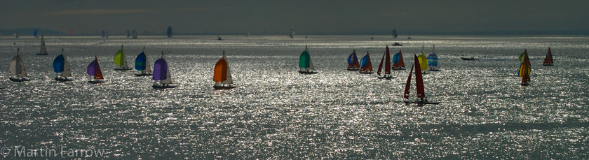 Evening-Panorama 
 Panoramic view of yachts in evening light 
 Keywords: Cowes Week, boats, sailing, sea, yachts,colour,evening,spread,sun,reflection,race,racing