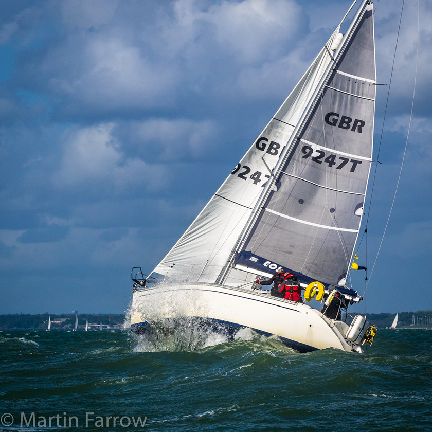 Rough-Ride 
 Yacht hit by wave rising in the water 
 Keywords: Battle of Britain, RAFYC, Solent, boats, racing, rally, sails, sea, splash, spray, water, waves, yachts