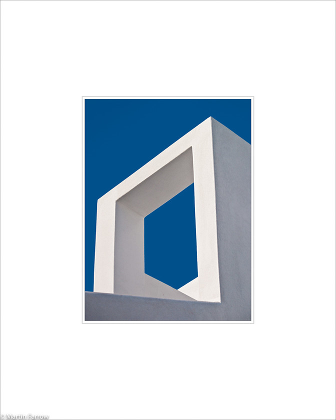 04 Escheresque 
 White square structure against blue sky with optical illusion 
 Keywords: ARPS panel fine art blue white simple abstract graphic architecture illusion escher structure wall sky Santorini Greece island