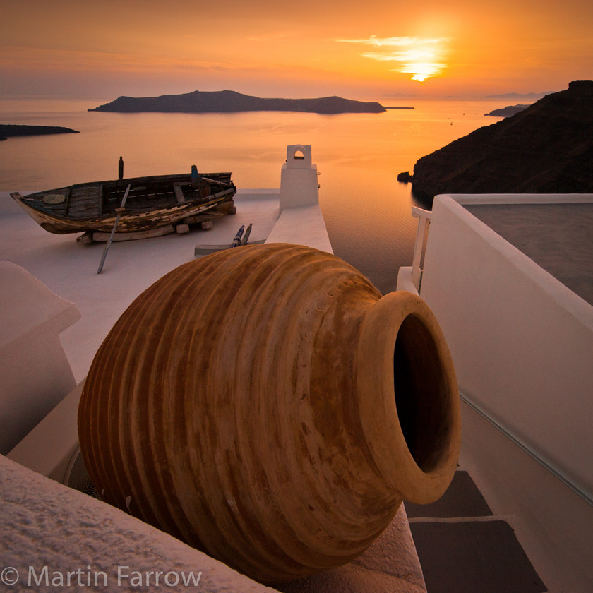 Santorini-Sunset 
 Sunset over Santorini 
 Keywords: Greece, Santorini, evening, sea, sunset, white, buildings,pot,amphora,boat,island,shore,coast