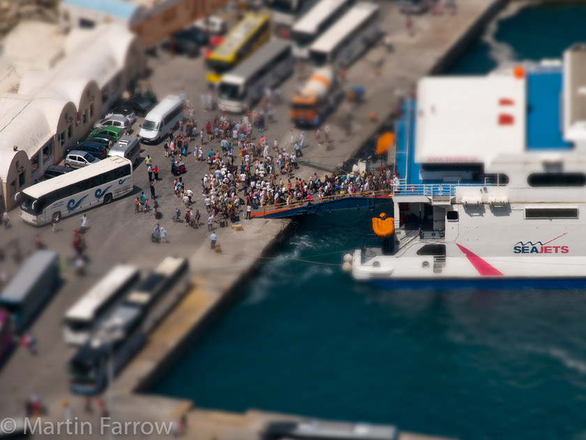 Disembarking 
 Passengers disembarking boat 
 Keywords: Greece, Santo Winery, Santorini, lines, shade, shadows,boat,people,disembark,small,bus,harbour,port,shallow depth of field,model,toy